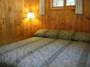 Cabin #14 offers 1 king bedroom, 2 queen bedrooms, and 1 bedroom with bunk beds.