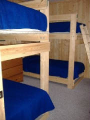 Cabin #16 Bunk Bedroom with dresser and hanging pole
