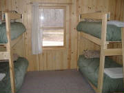 Bunk Bedroom with dresser and closet