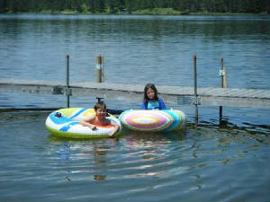 Our lake frontage is at lake level.  No steps to the water or docks.  Clamshell Lake warms earlier than the large lakes... so kids are in swimming early in the season.  The lake bottom in the docked off swimming area is sturdy sand.  Look at how clear our lake is!  