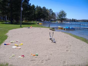 Sand Castle Zone on the lake front.  We keep a stock of shovels, buckets, sand toys here.  Fun times playing with friends!  Beach Lounge Chairs are next to the sand castle zone the adults!